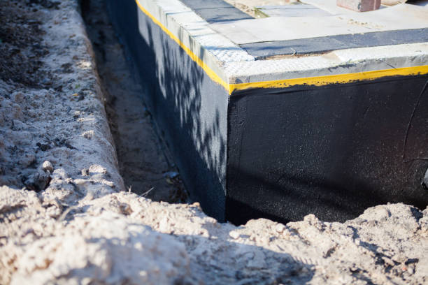 Professional Basement Waterproofing technician working in Wilmington, NC